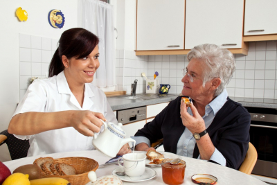 young lady preparing the meal of her patient